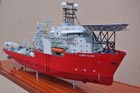 A triple deck pipe laying vessel with a heli-pad and four storey super-structure. Marine model - ship model.