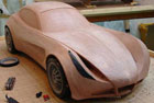 1/4 scale automotive clay sculpt of a kit car concept in progress