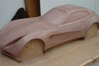 1/4 scale automotive clay sculpt of a kit car concept in progress